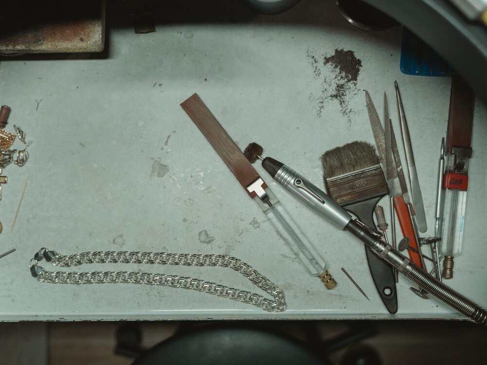 A jeweller’s bench tools laid out on a work surface